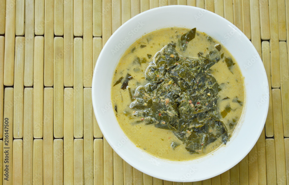 boiled Cassia tree leaf or Thai copper pod with coconut milk and curry on bowl boiled Cassia tree leaf or Thai copper pod with coconut milk and curry on bowl