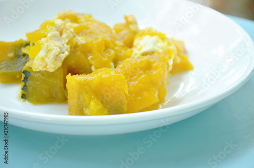 stir fried pumpkin with egg on plate