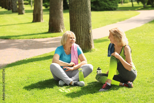 Sporty mature women sitting...