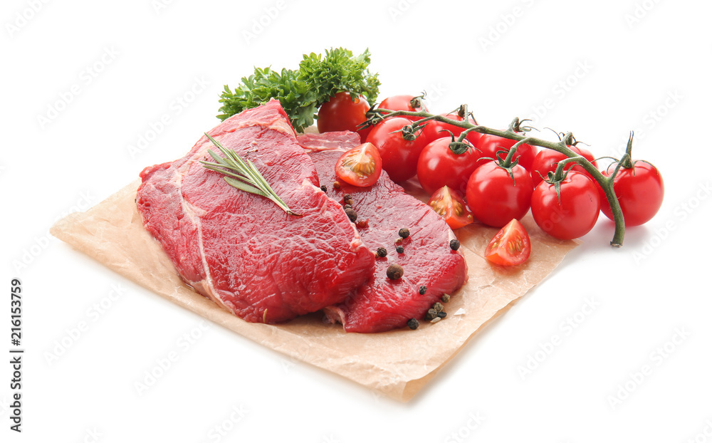 Fresh raw meat with spices, herbs tomatoes on white background Fresh raw meat with spices, herbs tomatoes on white background