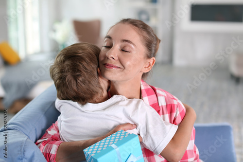 Mother receiving gift from ...