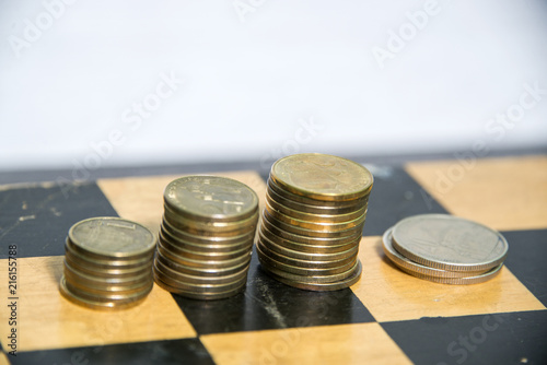 Money, coins sorted into piles