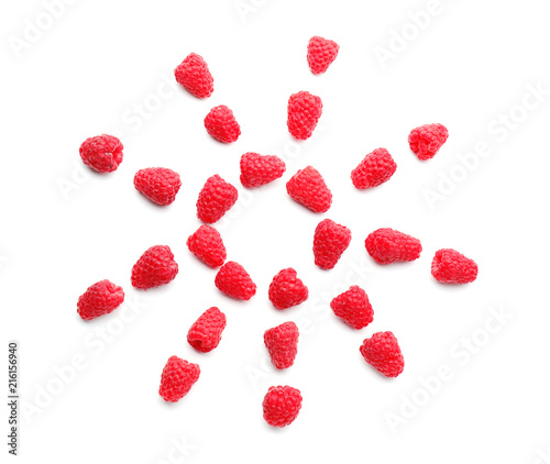 Composition with sweet ripe raspberries on white background