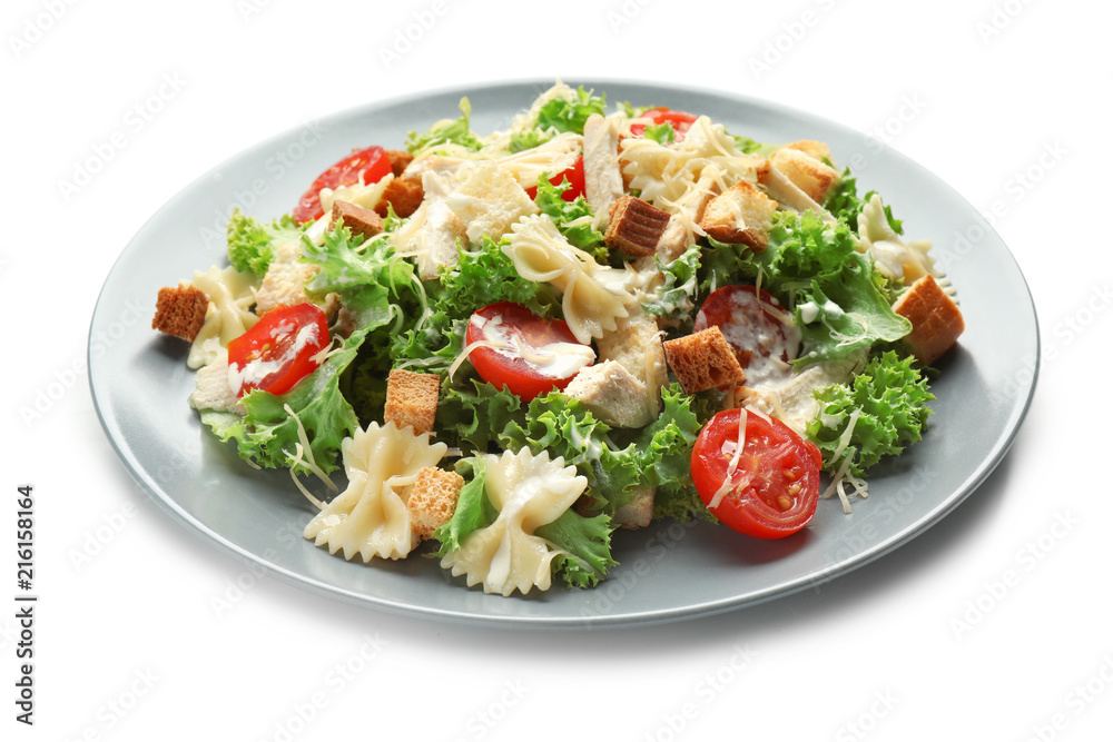 Tasty Caesar salad with pasta on white background