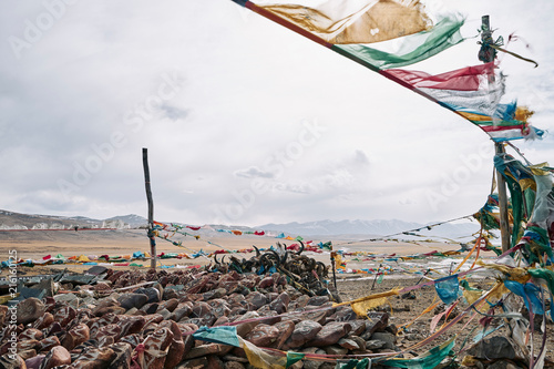 Mantra flags on beach, Burang, Xizang, China photo