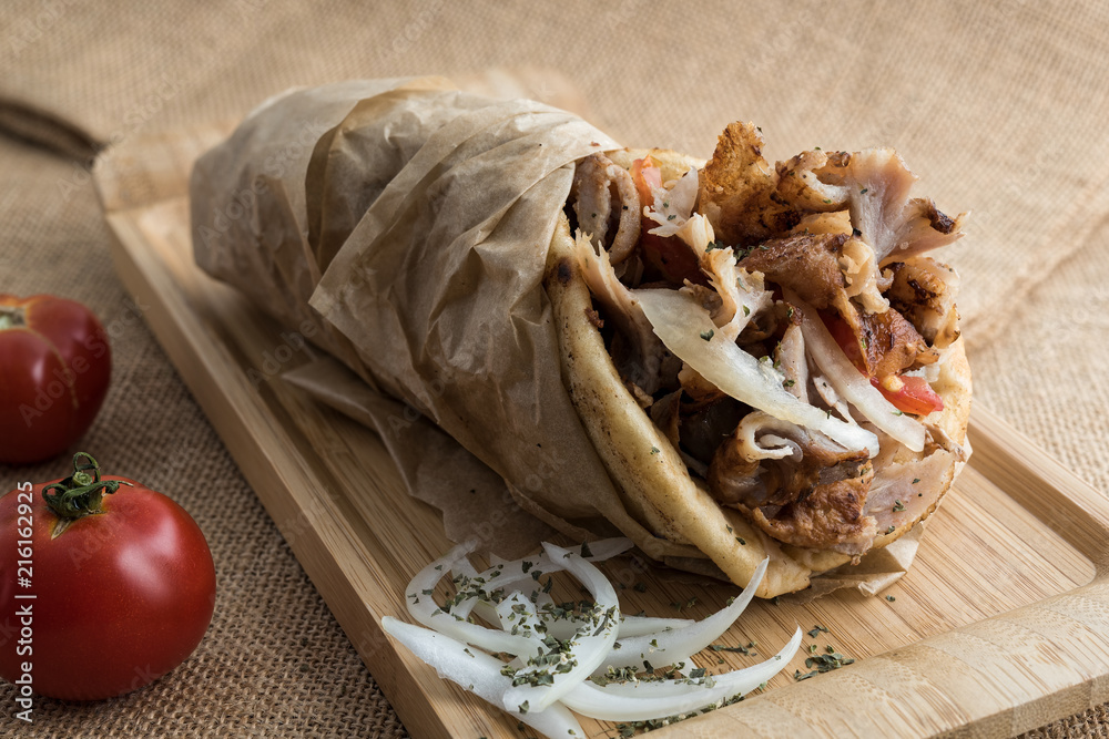 Ταπετσαρία Gyros wrapped in pita bread, a popular street food in Greece