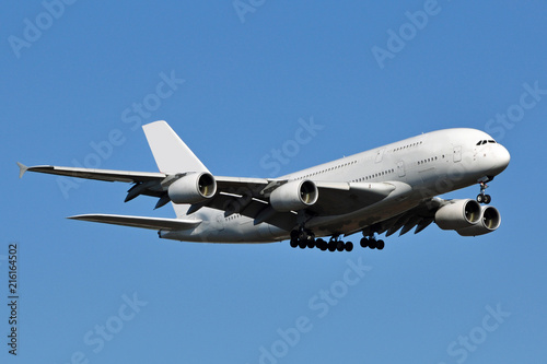 A large white double-decker passenger aircraft. photo