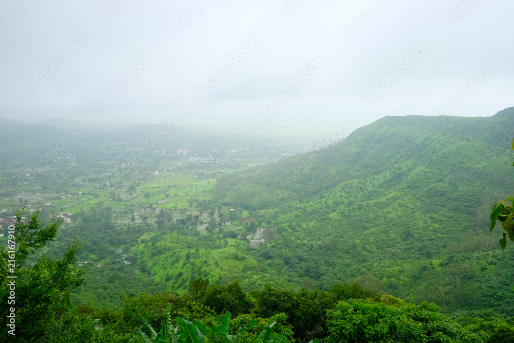 Lush green monsoon nature landscape mountains, hills, Purandar, Maharashtra, India 