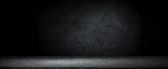 Dark room with tile floor and brick wall background