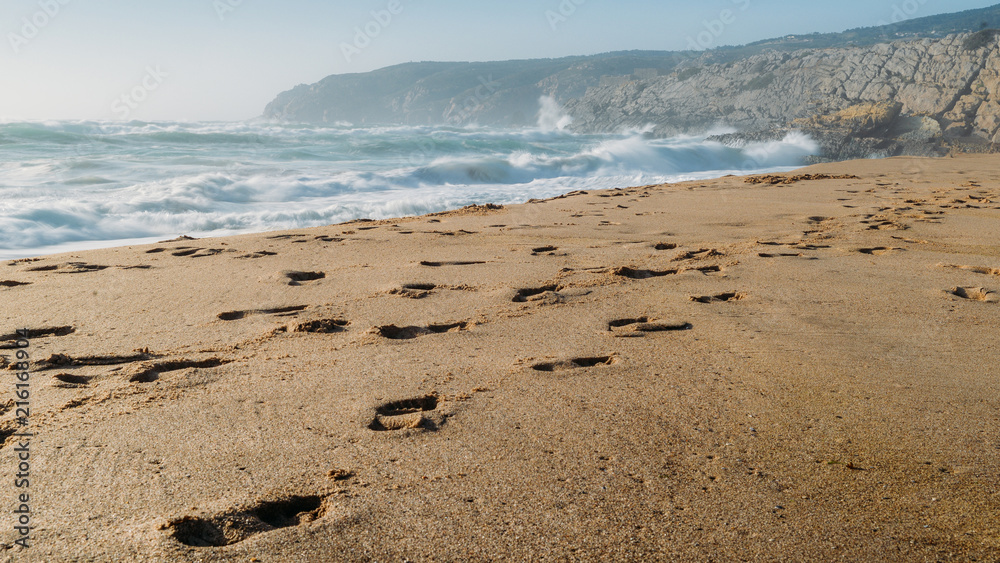 Footsteps at Guincho beach in Cascais, Portugal, a popular kitesurfing spot Footsteps at Guincho beach in Cascais, Portugal, a popular kitesurfing spot
