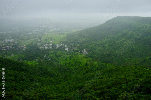 Lush green monsoon nature landscape mountains, hills, Purandar, Maharashtra, India  © Sandeep