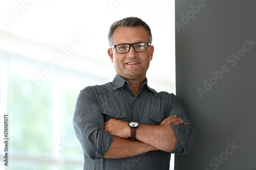 Portrait of mature businessman in office