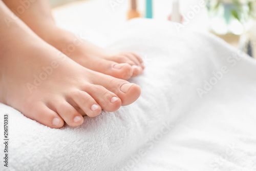 Young woman after getting professional pedicure in beauty salon, closeup