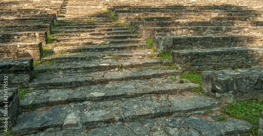 Old stone stairs, surrounded by green grass Old stone stairs, surrounded by green grass