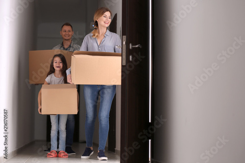 Happy family with cardboard...