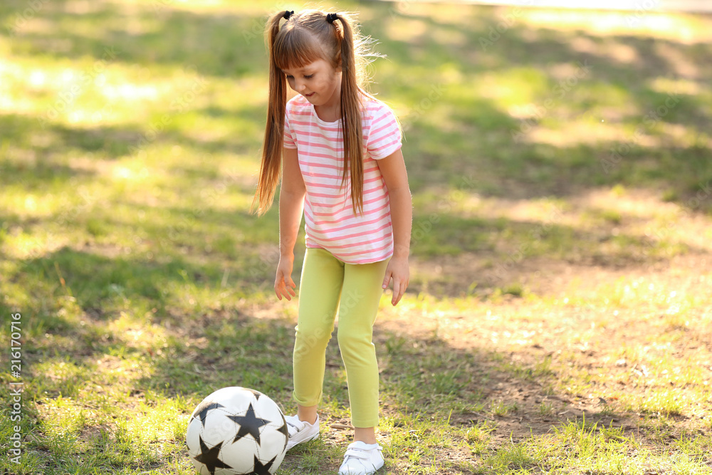 Cute little girl playing with ball outdoors Cute little girl playing with ball outdoors