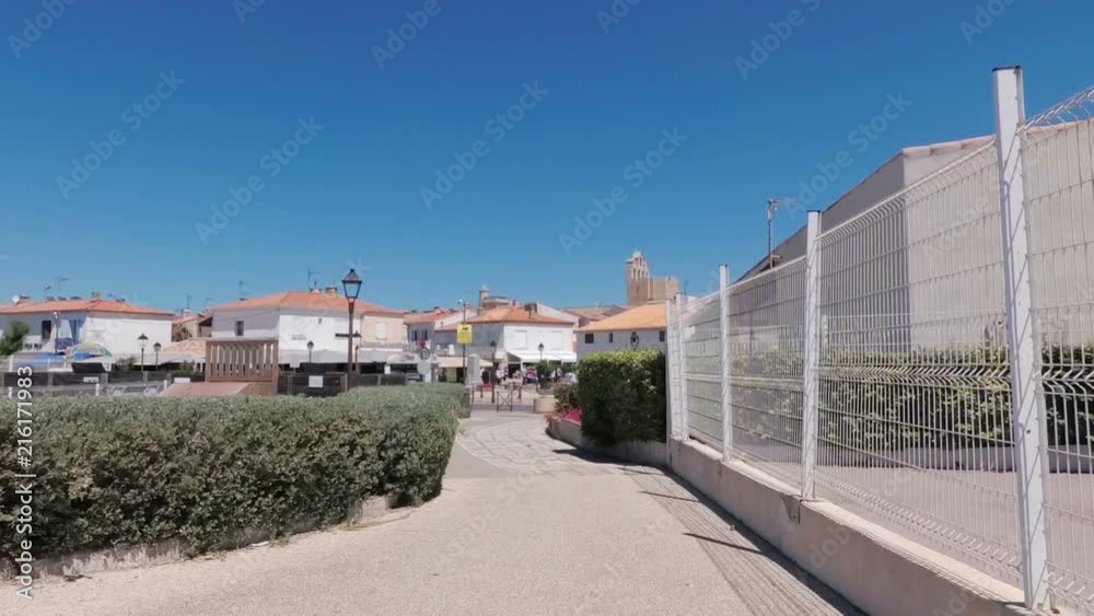 Sea resort town in the south of France Saint Marie de la Mer. The streets of the city under the hot June sun. France. Slow motion. Sea resort town in the south of France Saint Marie de la Mer. The streets of the city under the hot June sun. France. Slow motion.