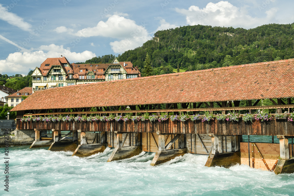 Old wooden floodgates on Aare river in Thun