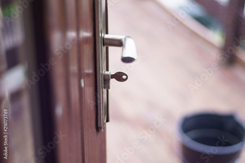 Opened house door, you can see what is outside. Door handle and key. © Rajtar photography