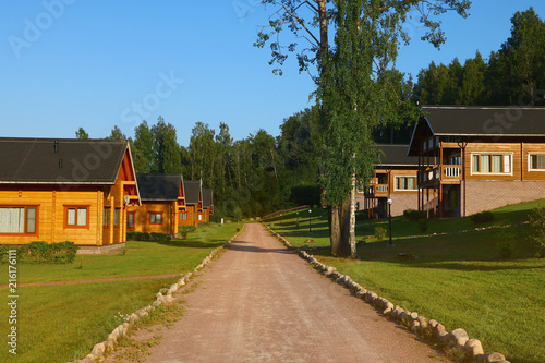 beautiful cottage village with wooden houses in summer