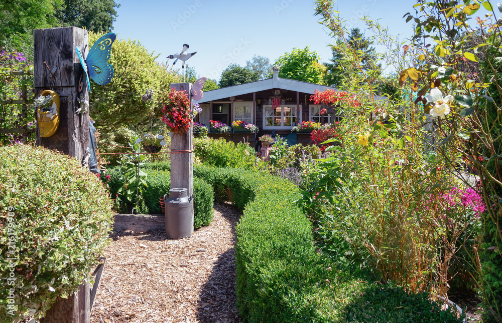 Garden shed surrounded by a beautiful decorative garden Garden shed surrounded by a beautiful decorative garden