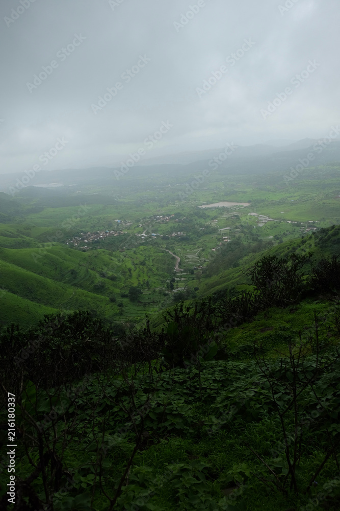 Lush green monsoon nature landscape mountains, hills, Purandar, Maharashtra, India 