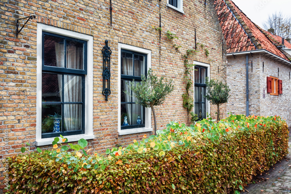 The side wall with window of a house in Bourtange, a Dutch fortified village in the province of Groningen