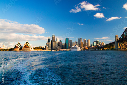 The city centre of Sydney, Australia, Opera house, business centre with skyscrapers and Harbour Bridge on the right, deep blue waters of the bay © Radoslav Cajkovic