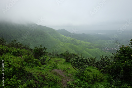 Lush green monsoon nature landscape mountains, hills, Purandar, Maharashtra, India 