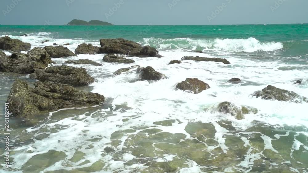 Slow Motion, Ocean wave with large wave crashing on rock Slow Motion, Ocean wave with large wave crashing on rock