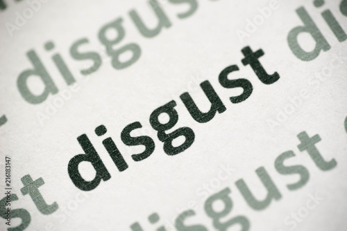 word disgust printed on paper macro