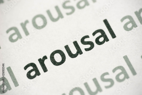 Photography word arousal printed on paper macro