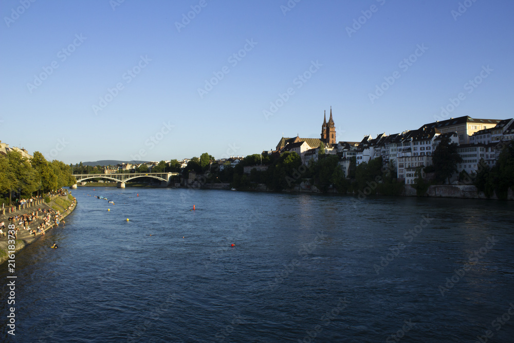 Basel with the river Rhine in the foreground and Basel's Old Town district in the background.