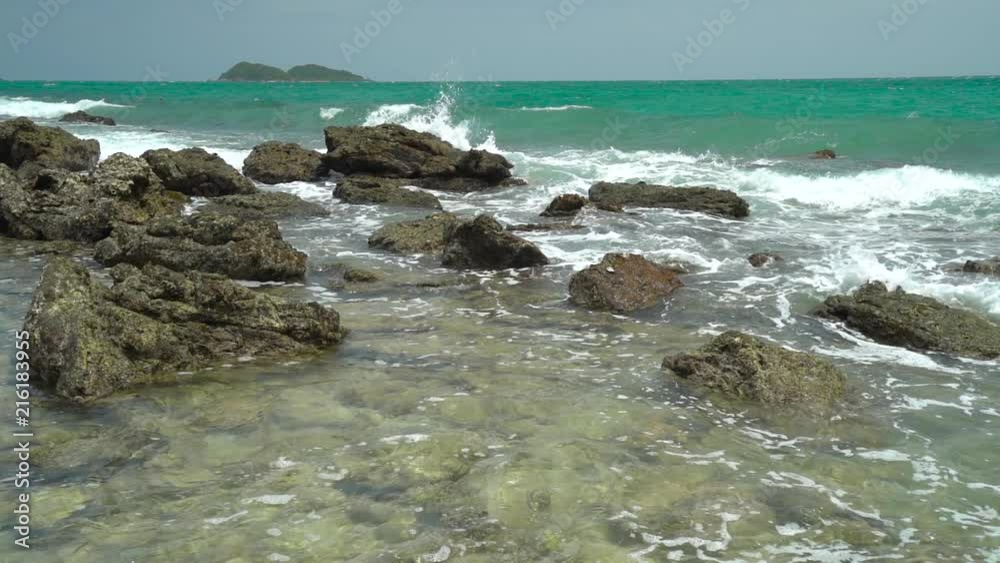 Slow Motion, Ocean wave with large wave crashing on rock Slow Motion, Ocean wave with large wave crashing on rock
