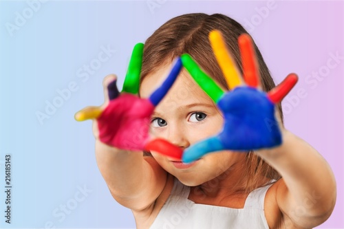 Lttle girl with colorful painted hands