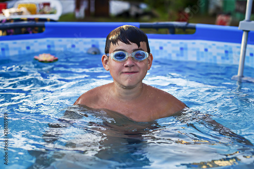 boy with glasses for swimming in the pool