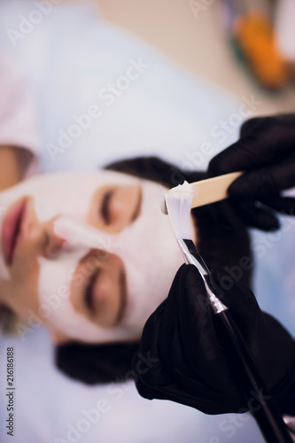 Process cosmetic mask massage and facials in beauty salon photo