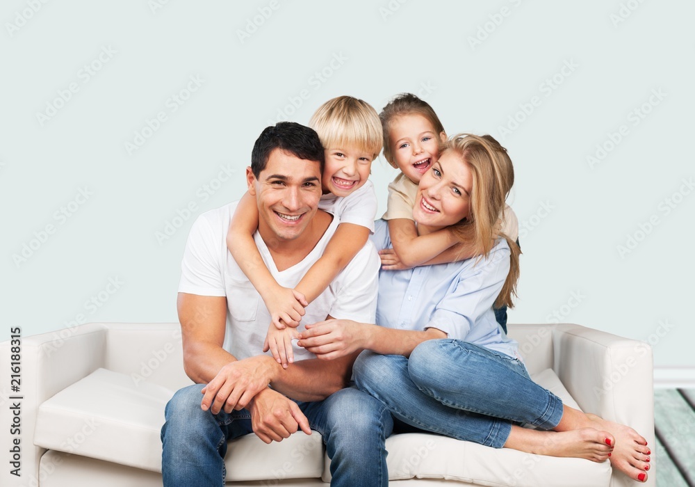 Beautiful smiling family on background Beautiful smiling family on background