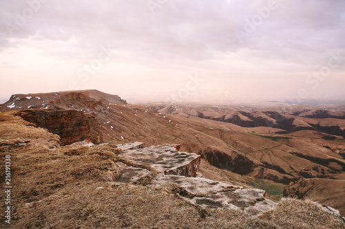 Russia, Karachay-Cherkessia, plateau Bermamyt. In the foreground stones, on a background vertical rocks.