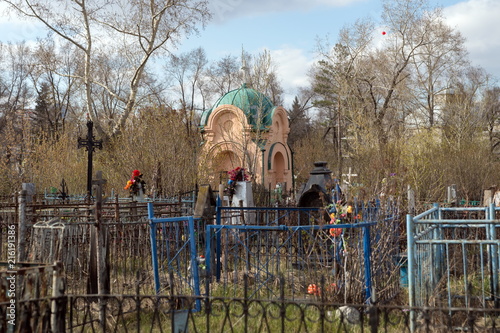 Charnelhouse of merchants Tokarev, a monument of 19th century among the graves on the Troitsk cemetery (1842) of the Krasnoyarsk city, in the spring. Krasnoyarsk Territory, Russia.