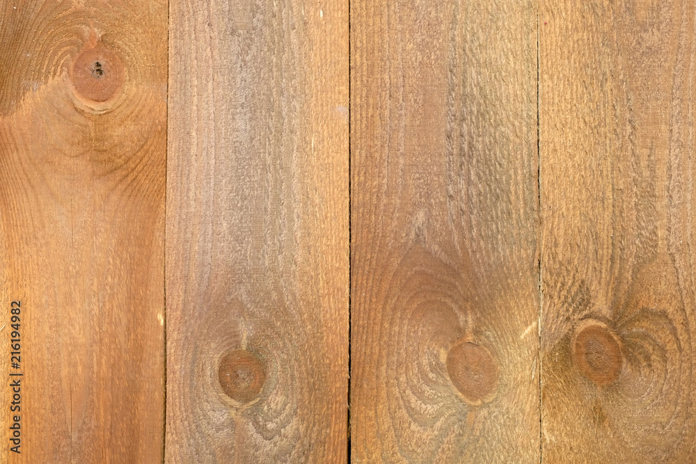 Obraz premium Painted brown color vertical wooden boards as background front view close up