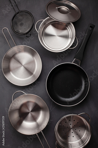 Set of kitchen metallic pans. Mockup, kitchen utensils, recipe book and cooking classes concept
