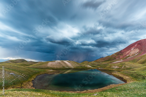 View of Tulpar Kul lake in Kyrgyzstan during the storm