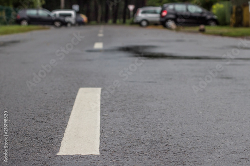 wet asphalt road with a dividing strip