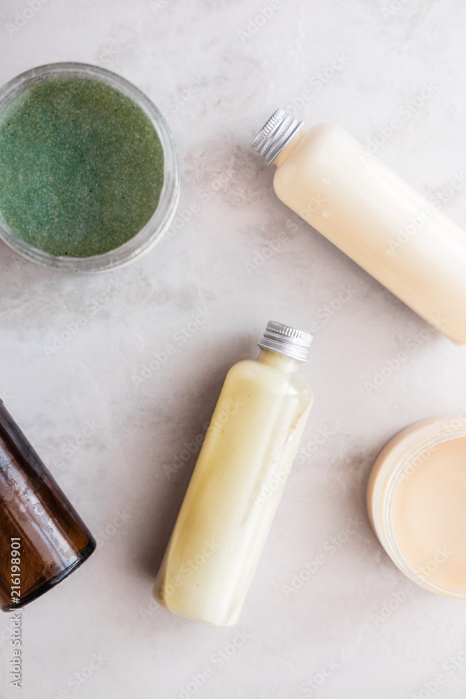 Spa cosmetics on white marble background from above. Beauty blogging concept Spa cosmetics on white marble background from above. Beauty blogging concept