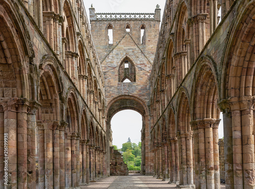 View at arches inside ruins of Jedburgh abbey in Scottish borders
