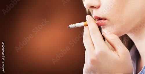 Portrait of the young elegant girl smoking