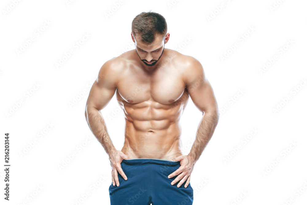 bodybuilder posing. Beautiful sporty guy male power. Fitness muscled in blue shorts. on isolated white background. Man with muscular torso. Strong Athletic Man Fitness Model Torso showing six pack abs