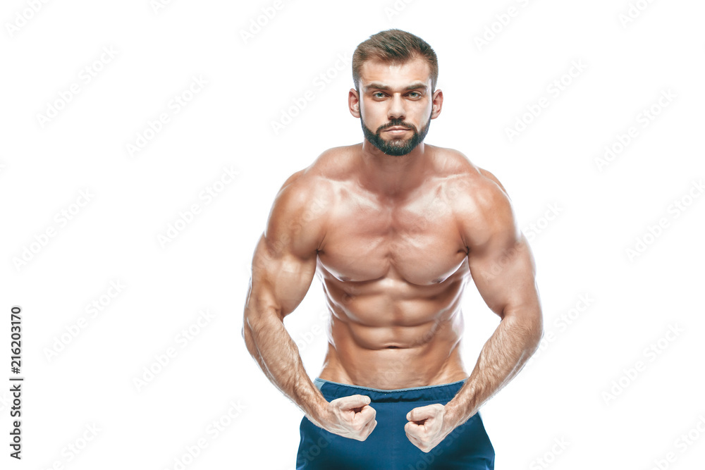 bodybuilder posing. Beautiful sporty guy male power. Fitness muscled in blue shorts. on isolated white background. Man with muscular torso. Strong Athletic Man Fitness Model Torso showing six pack abs bodybuilder posing. Beautiful sporty guy male power. Fitness muscled in blue shorts. on isolated white background. Man with muscular torso. Strong Athletic Man Fitness Model Torso showing six pack abs