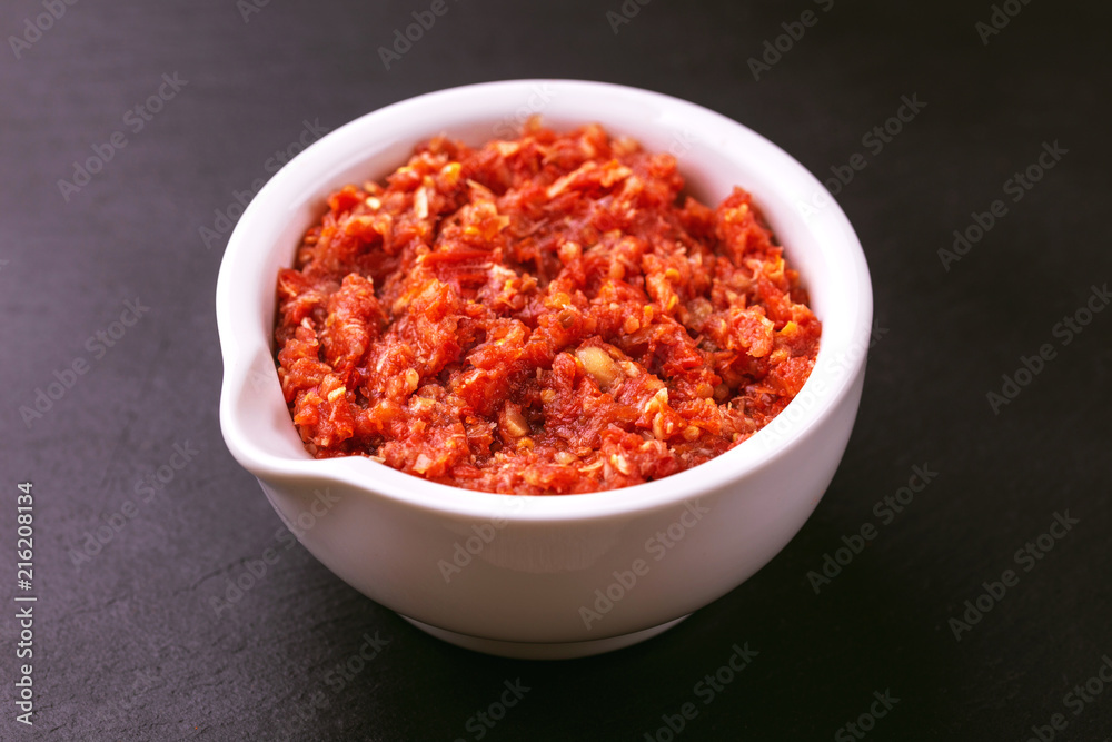 Traditional Maghrebi hot chili pepper sauce paste harissa. adjika Traditional Maghrebi hot chili pepper sauce paste harissa. adjika